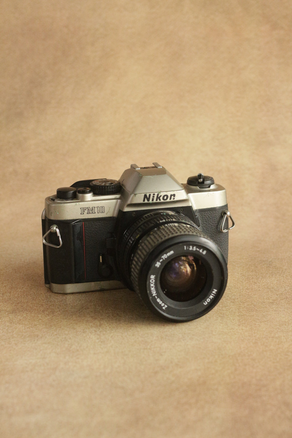 Nikon FM10 + Nikkor 35-70mm Zoom
